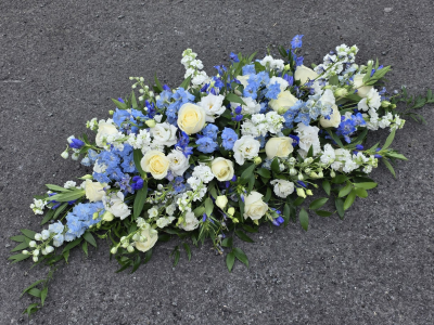 blues and white casket spray - mid and pale blues with white and ivory, not available autumn and winter months, summer is best for varieties n.b these may vary due to availability  4ft, 5ft or 6 ft sizes blues and white casket spray - mid and pale blues with white and ivory, not available autumn and winter months, summer is best for varieties n.b these may vary due to availability  4ft, 5ft or 6 ft sizes