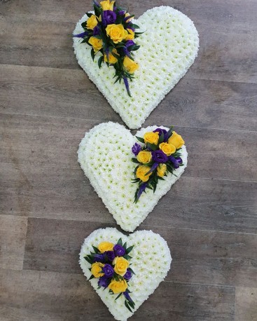 trio of hearts in white, yellow and purple