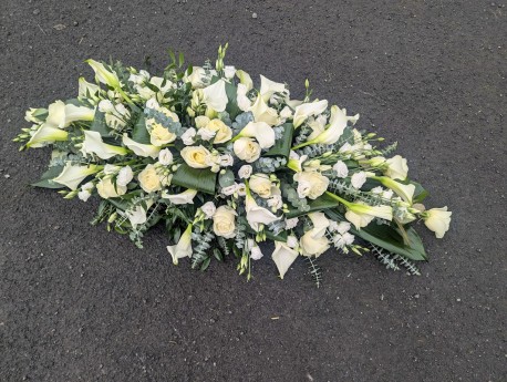 casket sp with calla, roses, lisianthus in neutral shades